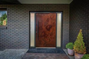 Oxidised iron pivot door for a grand entrance to home