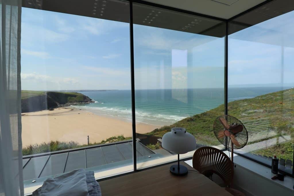 Floor-to-ceiling glazing overlooking the sea, showcasing the expansive views possible with architectural glazing